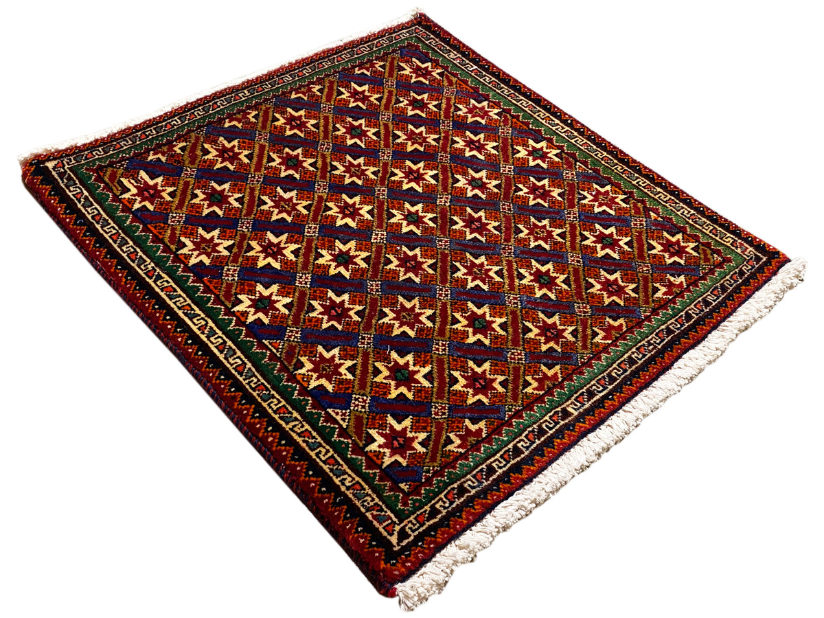Poshti rug 62x52 cm, flat display: colorful stars in a dark red frame, fringes.