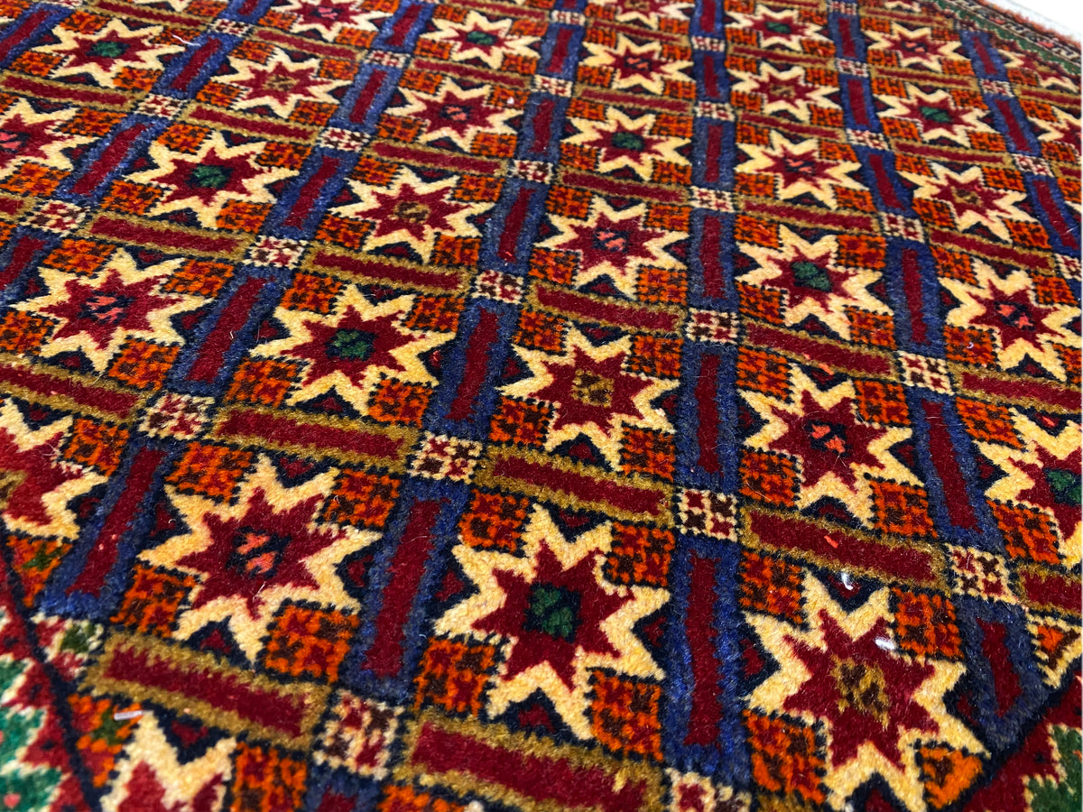 Poshti rug 62x52 cm close-up of the woven texture with star and diamond patterns.