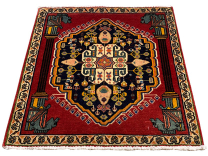 Poshti rug, covering the entire surface with a red background and golden and blue ornamental borders