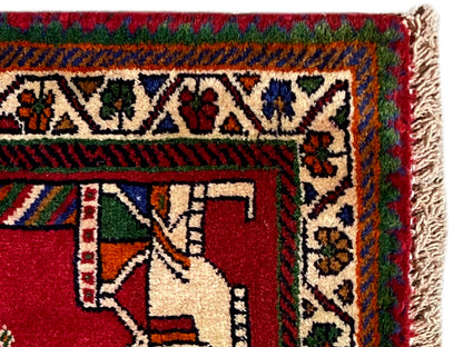 Poshti rug 58x68 cm: Detail with fringes and red pattern featuring hand motifs