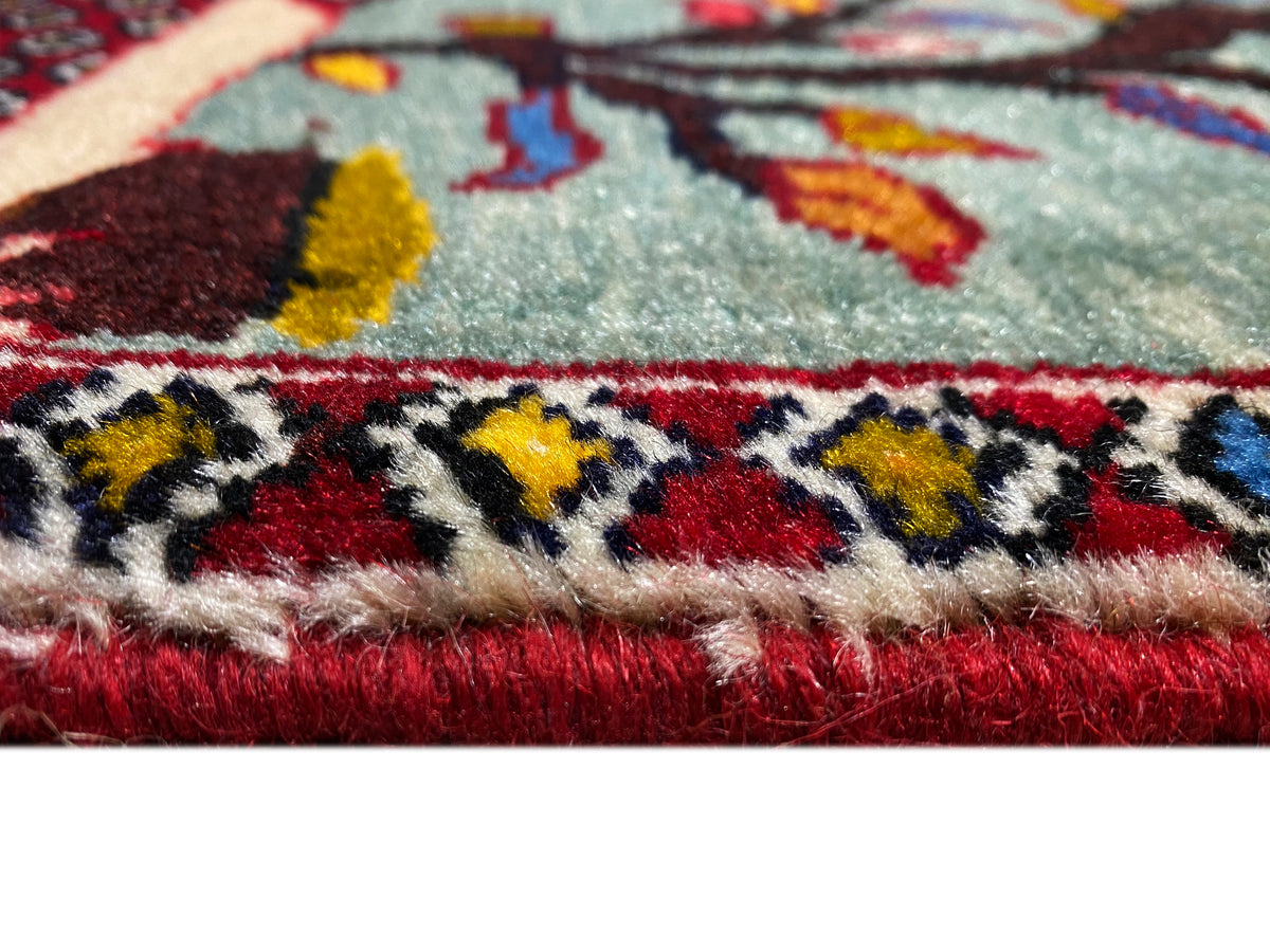 Poshti rug 68x63 cm close-up: woven pattern with fringes and multicolored border