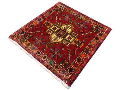 Poshti rug with a red background and geometric pattern, multicolored border, rectangular