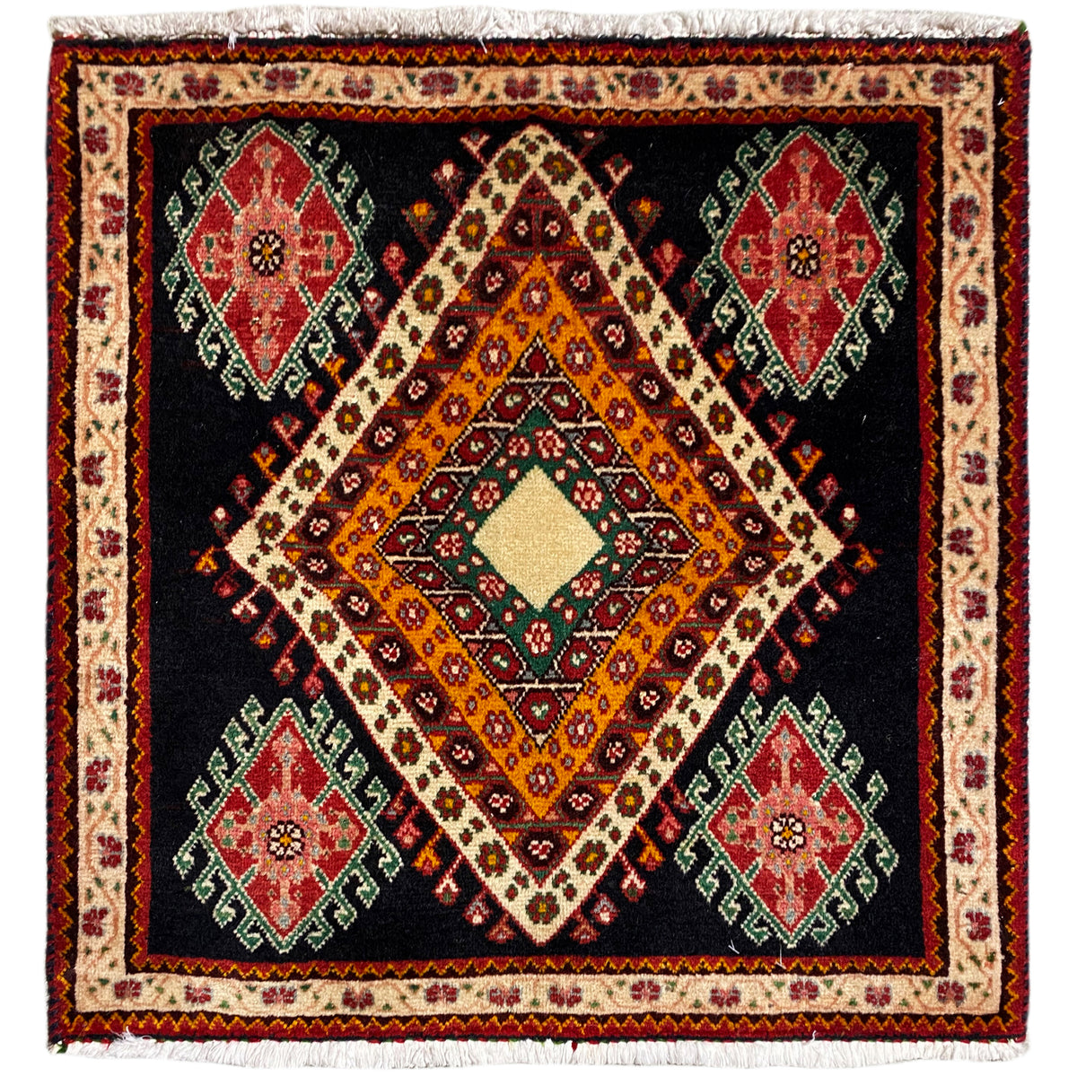 Poshti rug in a rectangular format with a black background, a central diamond pattern, and colorful medallions