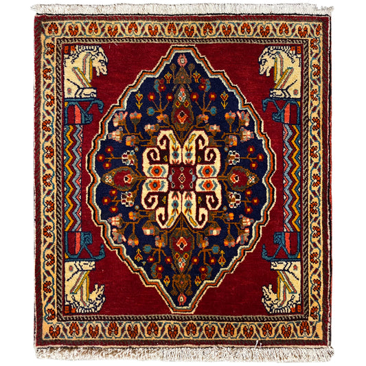 Square rug with a red background, blue medallion, and beige border elements