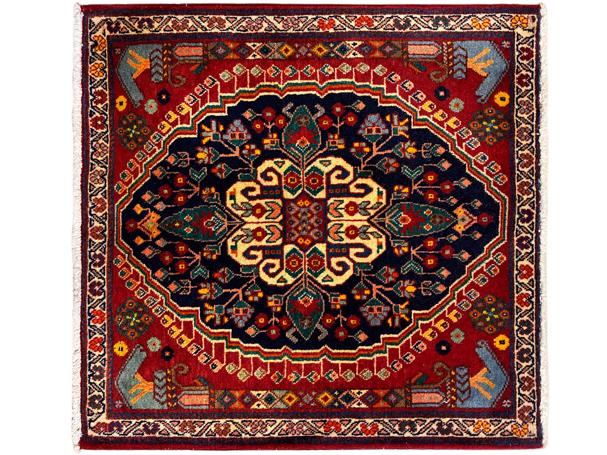Square rug 67x60 cm, red field with a dark blue medallion and ornaments