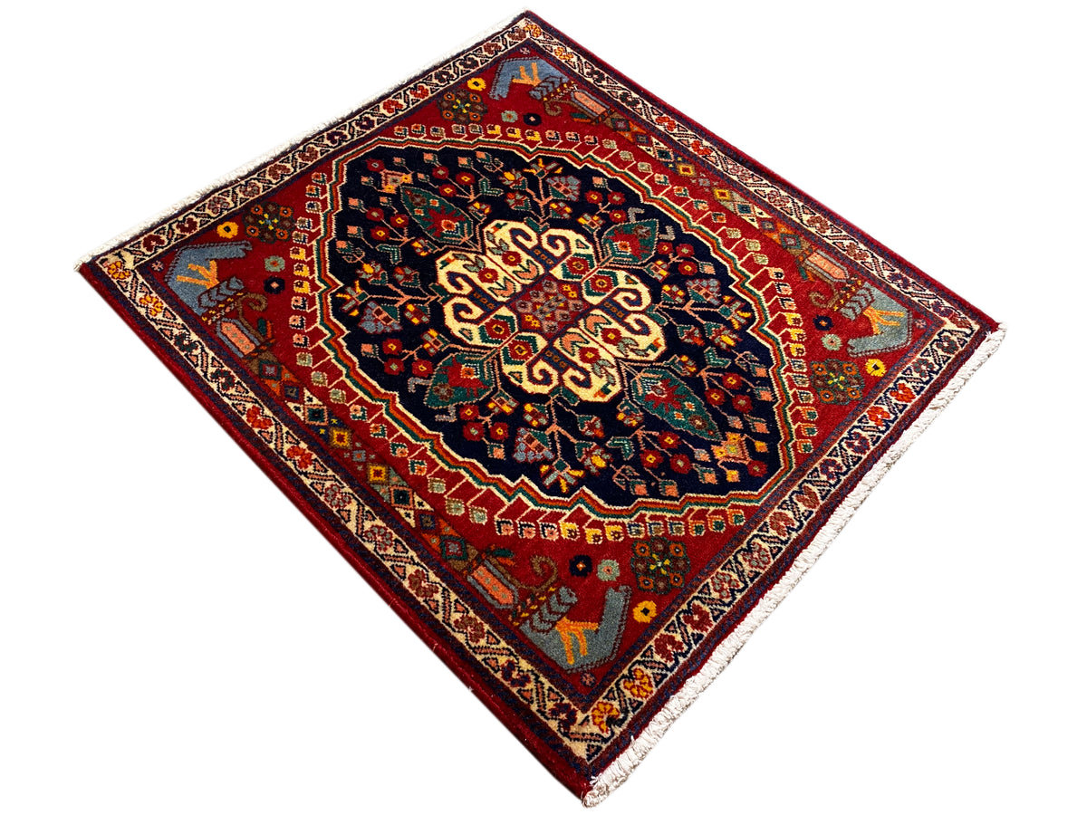Square 67x60 cm rug, red background with dark blue and gold central ornamentation