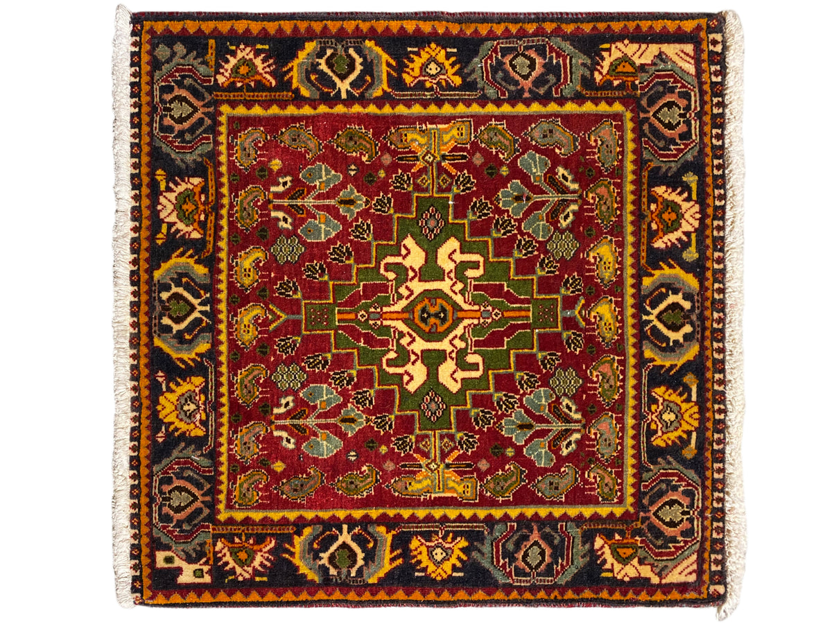 Carpet with a red central field, green-yellow ornaments, and a dark border pattern