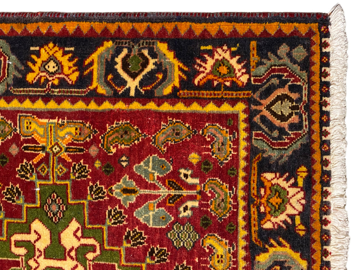 Rug edge with a dark border, yellow-orange diamonds, and white fringe trim