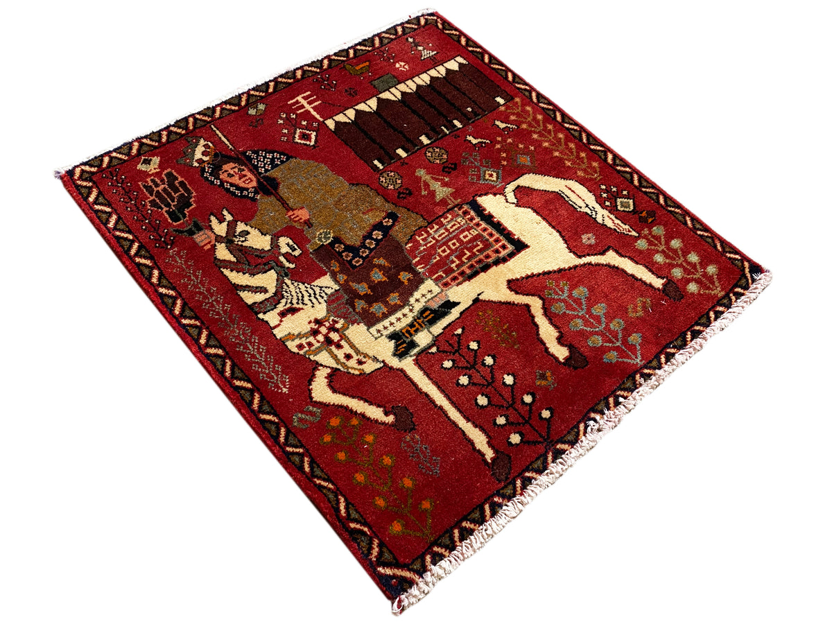 Poshti rug with red pattern, horses and ornaments, visible fringes