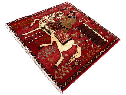 Poshti rug with a red pattern, stylized animals and ornaments, with fringes