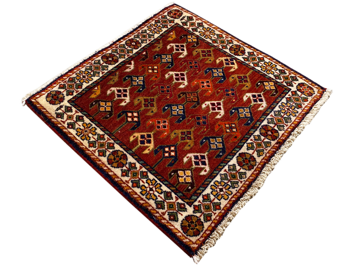 Carpet 61x61 cm with a red background and colorful geometric patterns, with a border around the edge