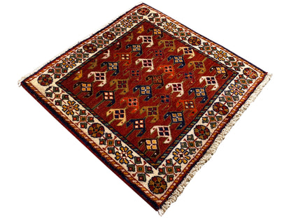 Carpet 61x61 cm with a red background and colorful geometric patterns, with a border around the edge