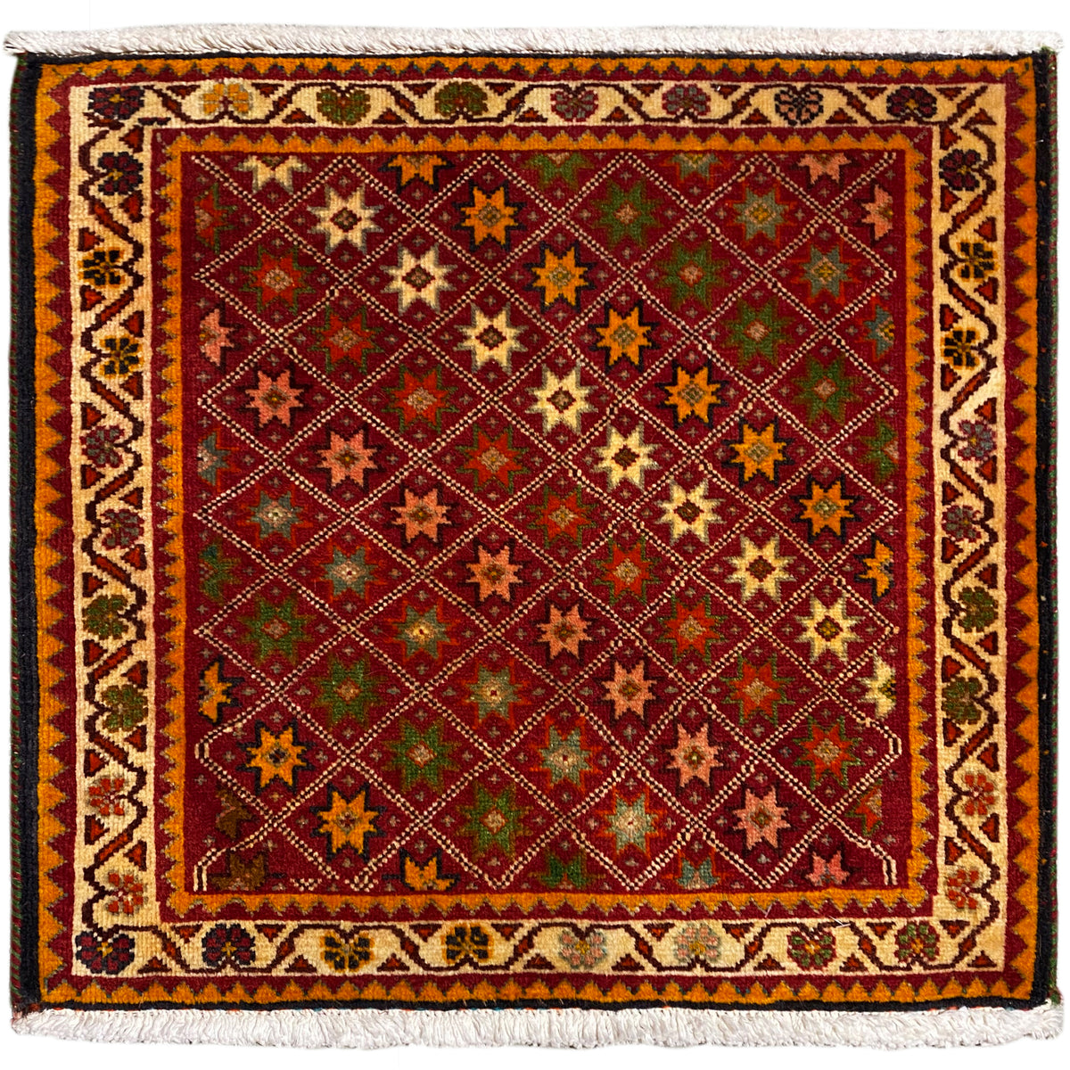 Poshti rug, rectangular, multicolored with ornamental star patterns and a fringed edge.