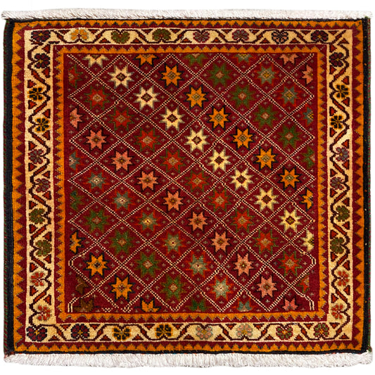 Poshti rug, rectangular, multicolored with ornamental star patterns and a fringed edge.