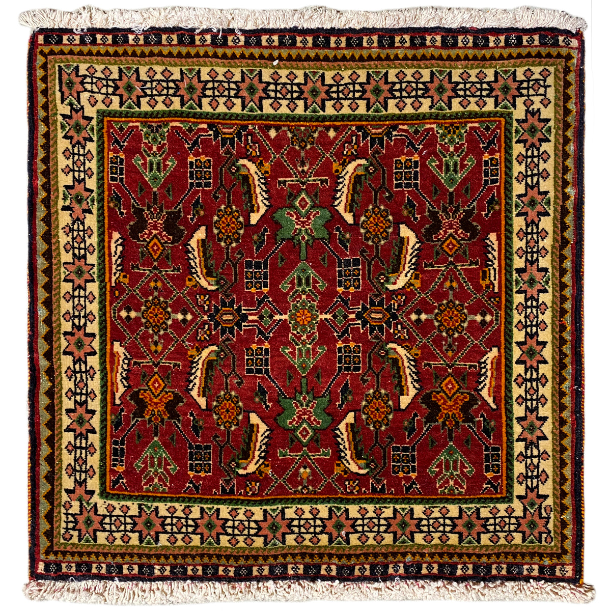 Poshti rug 63x61 cm with a red and green pattern, with fringes along the edge.