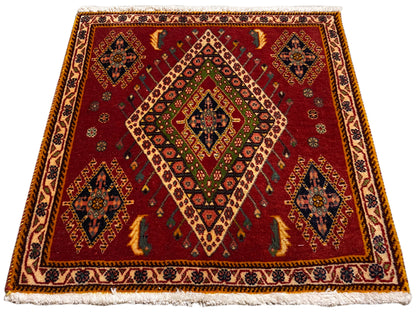 Poshti rug with red flat weave and diamond pattern, framed by borders
