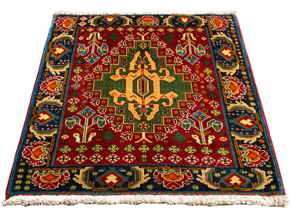 Rectangular rug (67x66 cm) with a red field, central medallion, and multicolored borders