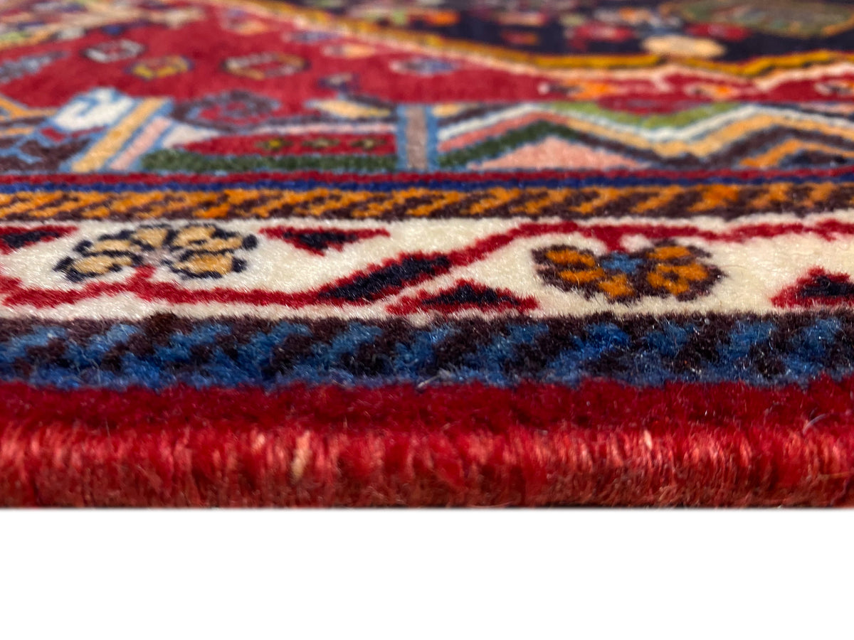 Poshti rug: fringed seam and selvedge with a color gradient from blue to red