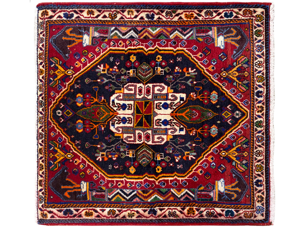 Square rug with a dark blue background, red border, and centered ornament, 70x67 cm