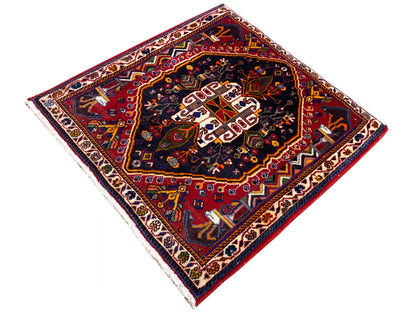 Rug 70x67 cm: dark ornamental pattern in the center, red and blue color palette, bordered edge