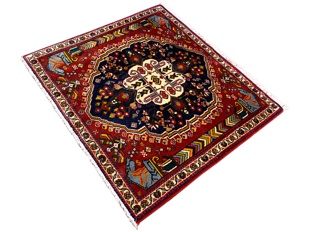 Poshti rug 65x61 cm, diagonal view: red field with a dark pattern and border ornaments
