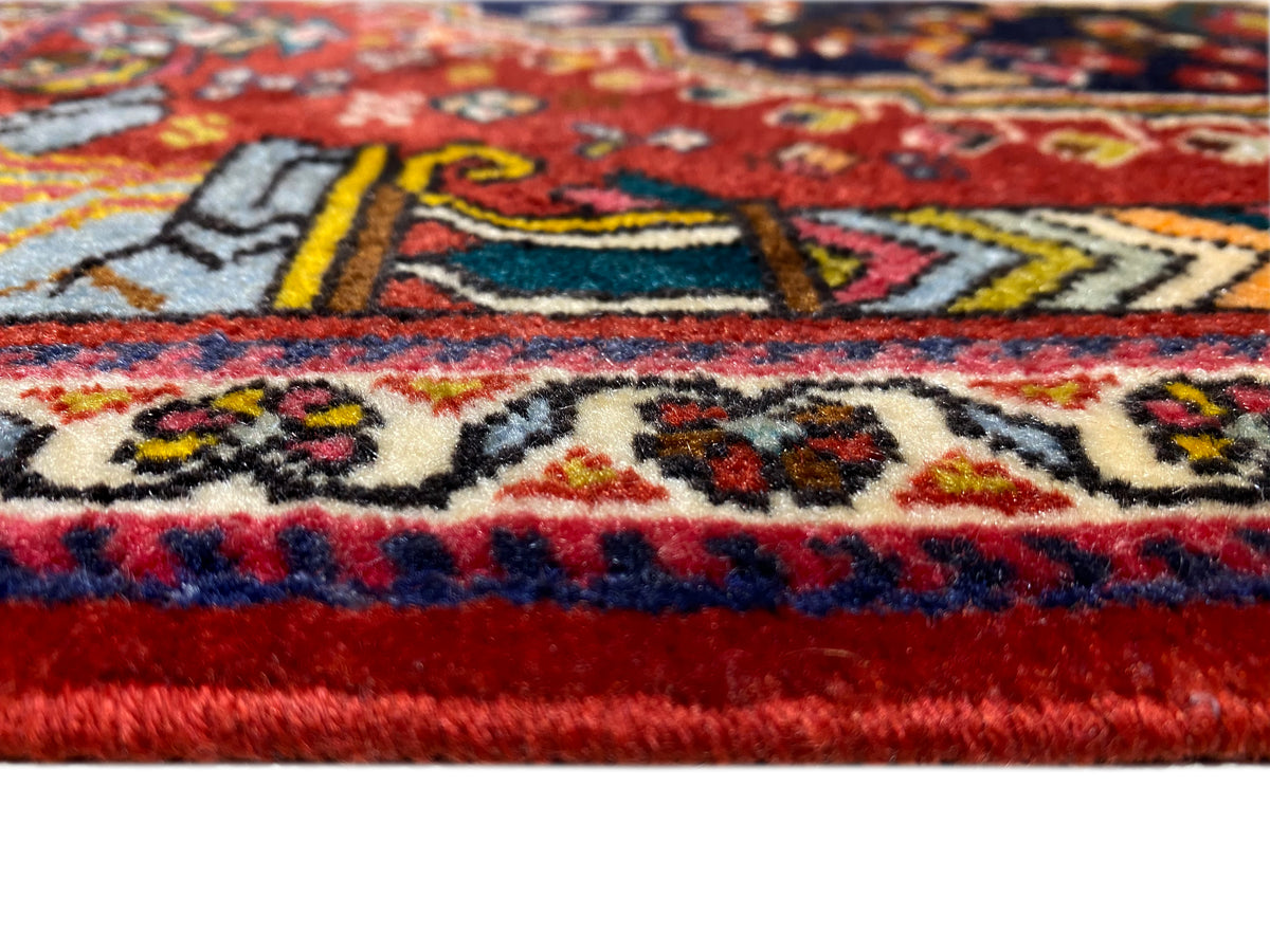 Poshti rug 65x61 cm close-up of the border: red, blue, and multicolored ornaments