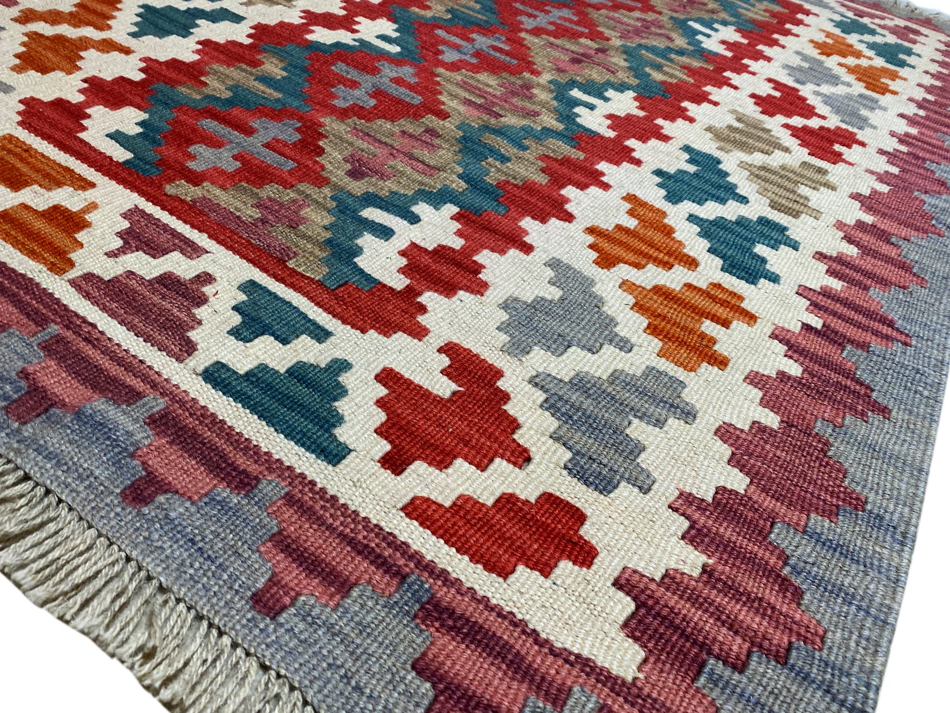 Flachgewebter Kelim Teppich mehrfarbig mit Tribal Design