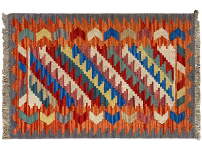 Boho Teppich Kelim Orange mit blauen Akzenten und geometrischen Formen